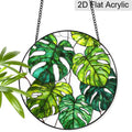 Monstera acrylic suncatcher with green tropical leaf design
